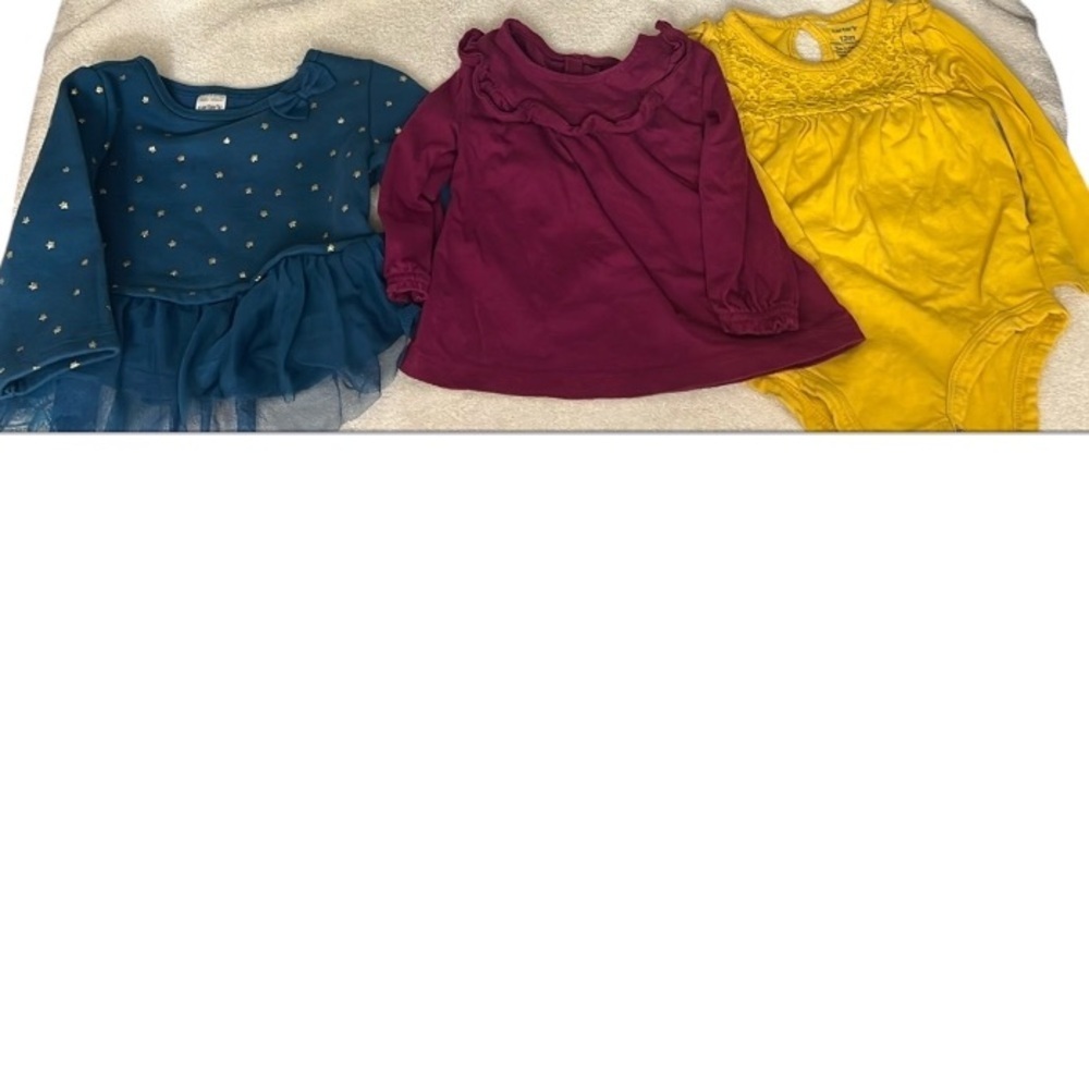 Carters bundle, a long-sleeved mustard yellow onesie, purple/blue blouse…